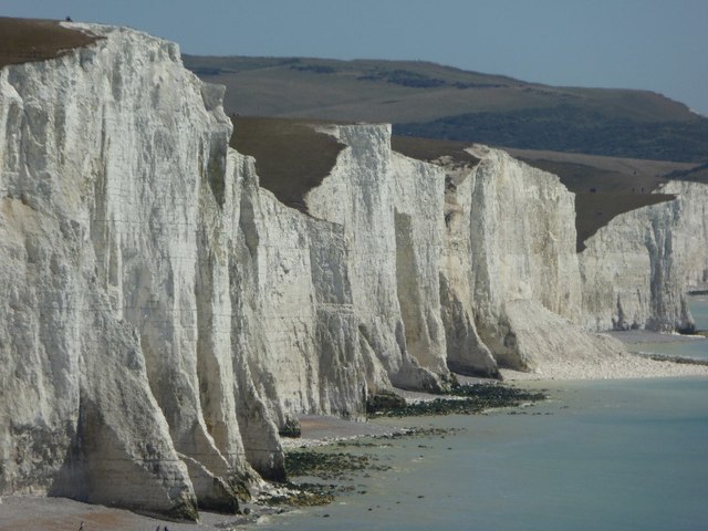 The white chalk cliffs of the Seven Sisters seen from above Cuckmere Haven